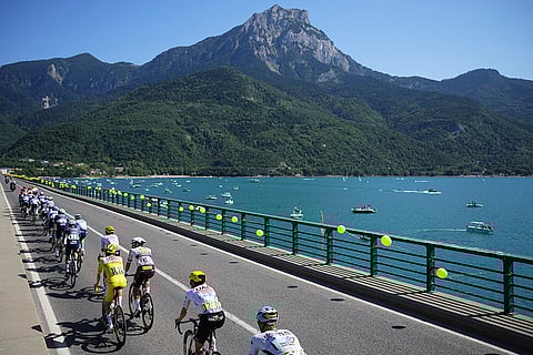 Pack rides towards Savines-le-Lac during the eighteenth stage of the Tour de France